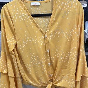 Blouse- ruffled sleeve and tie on waist.